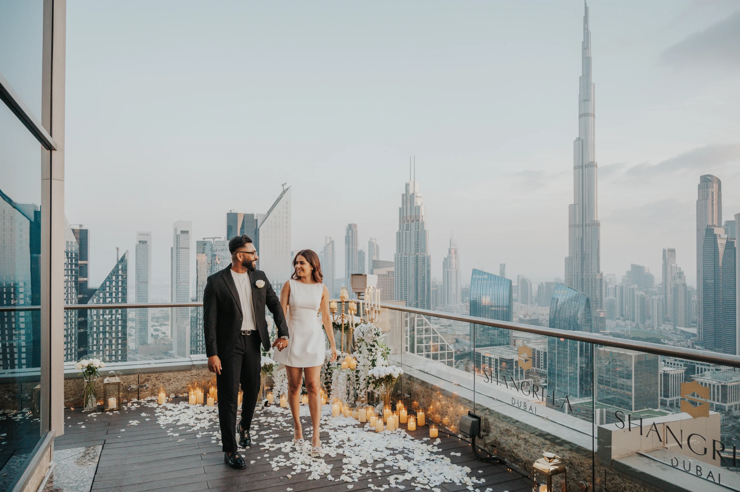 Couple during their proposal with the Burj Khalifa in the background