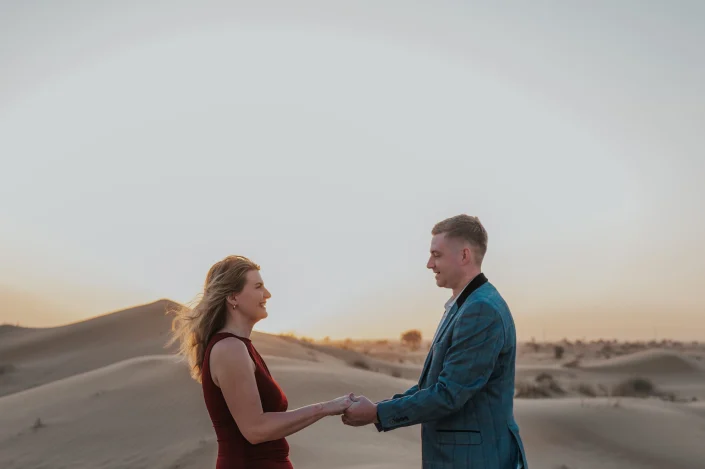 Couple holding hands during their proposal photoshoot in dubai